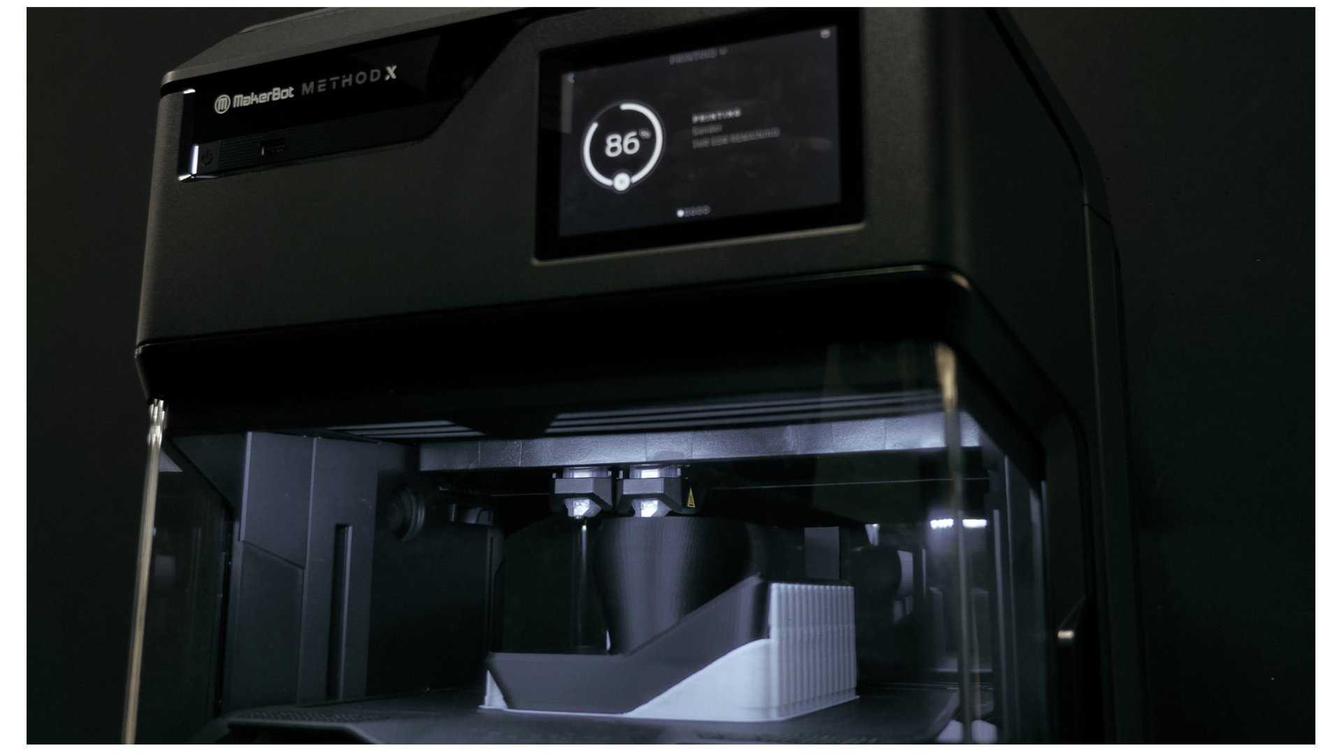 The MakerBot METHOD uses dual extruders to print dissolvable support material underneath the model.