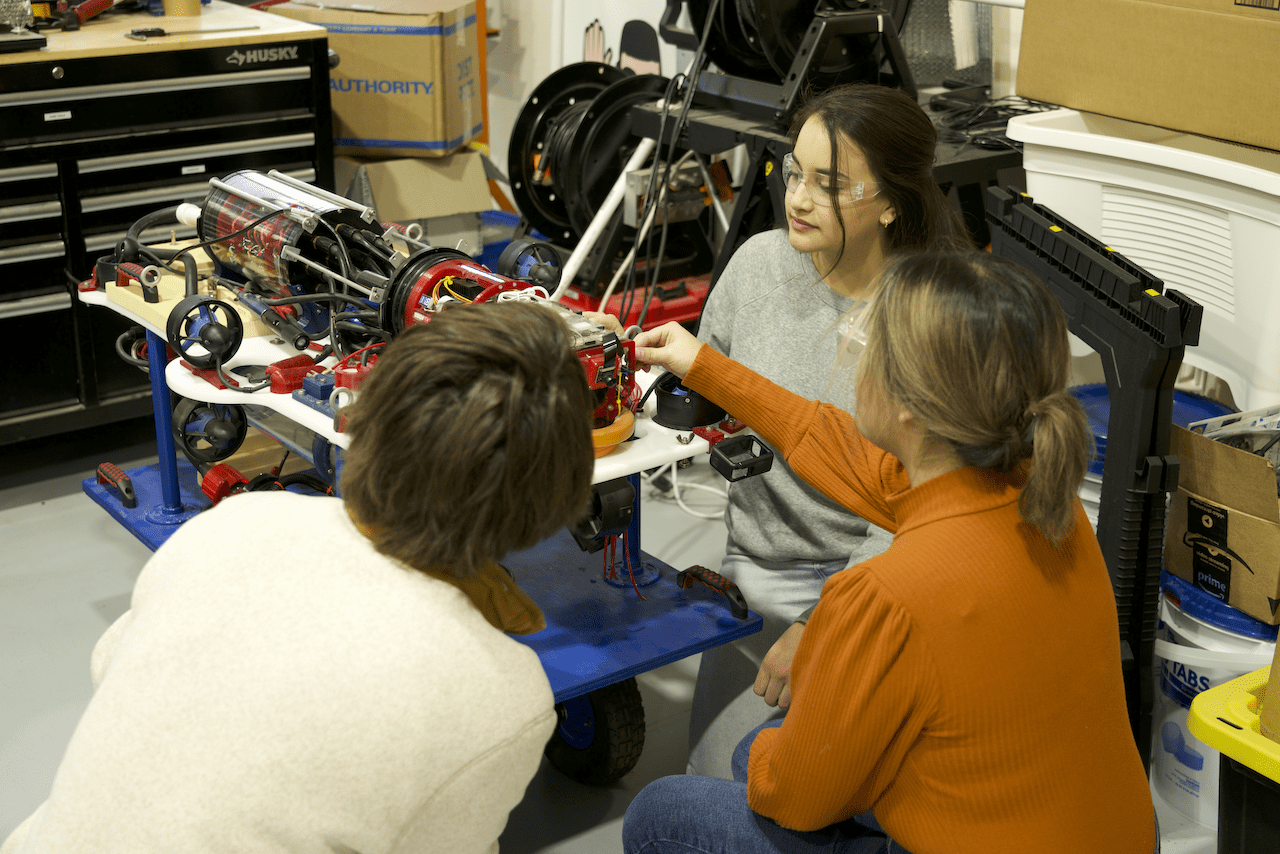 Students test out the design of their underwater robot.